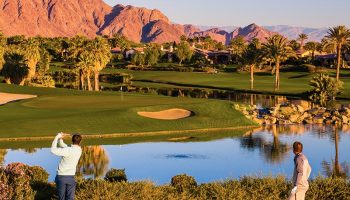 Golfers on tee overlooking beautiful mountains at Andalusia